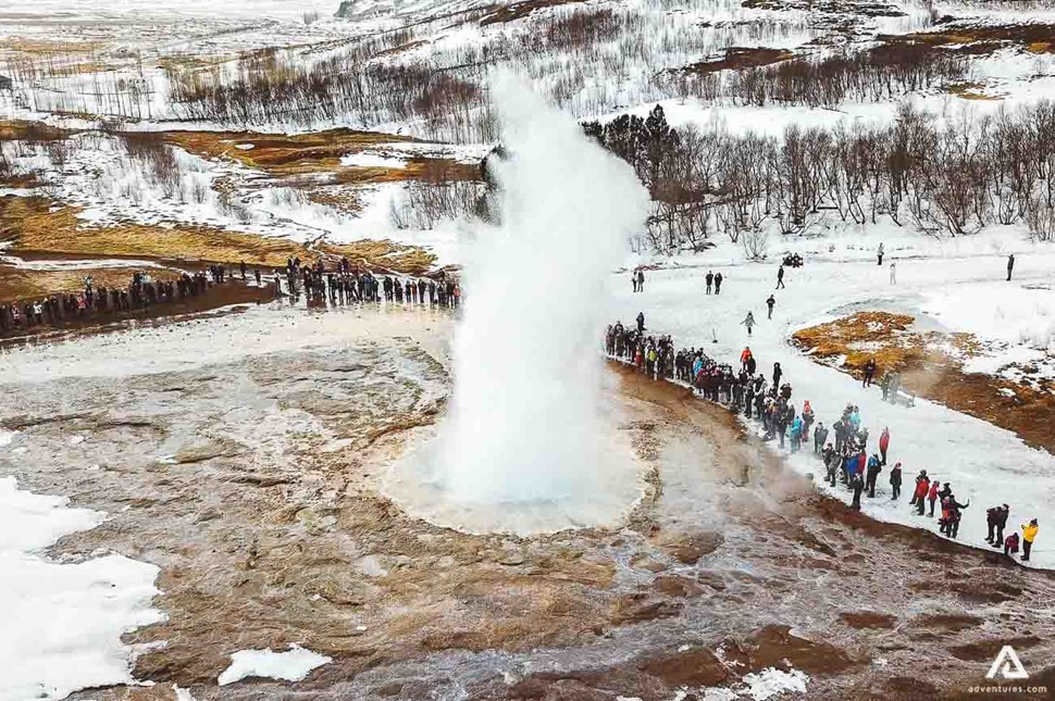 People Visiting Geysir Strokkur In Iceland