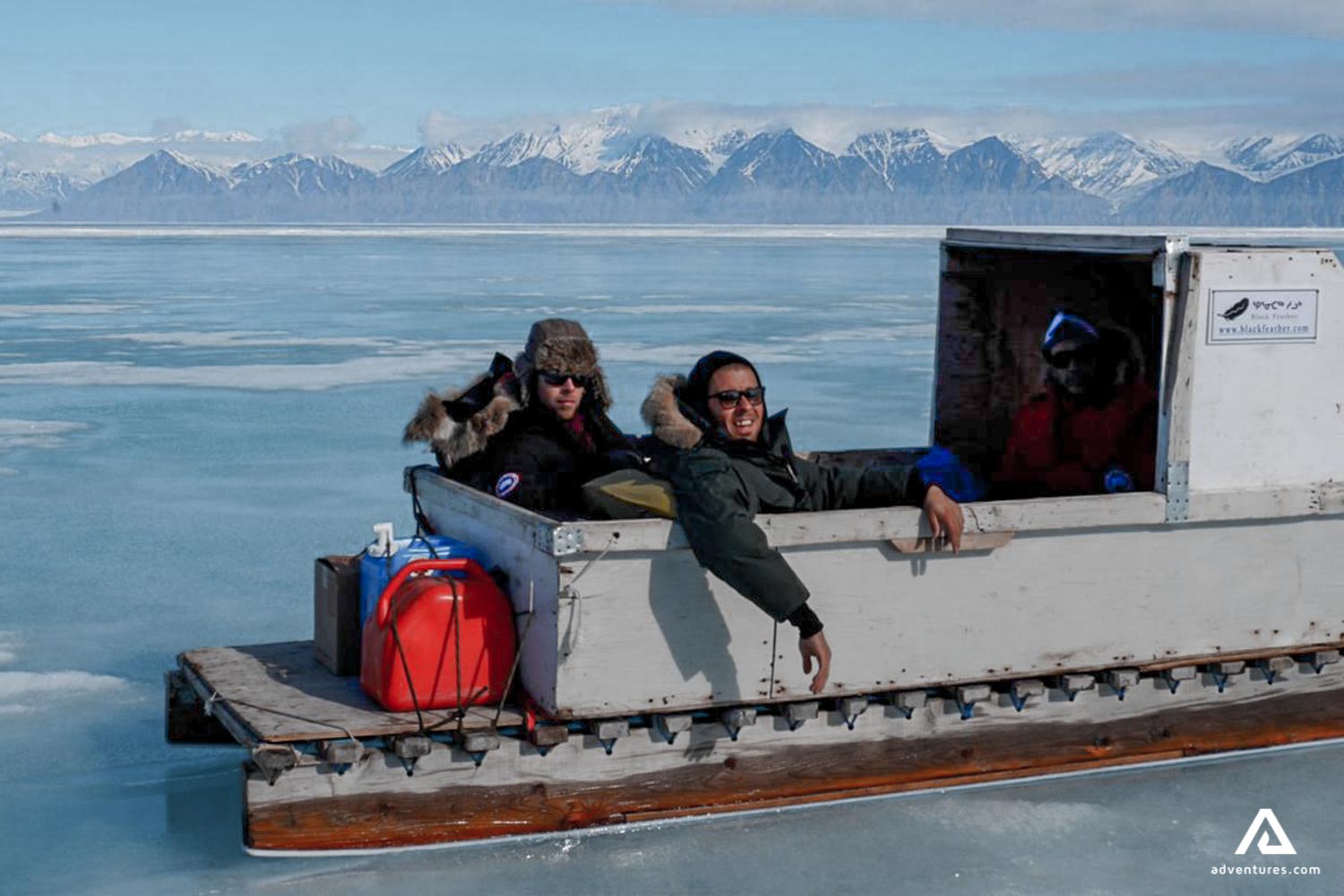 komatik sleds on ice with people