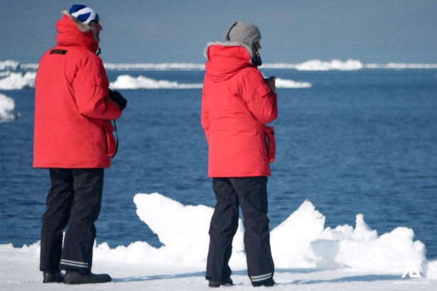 explorers with red jackets on ice