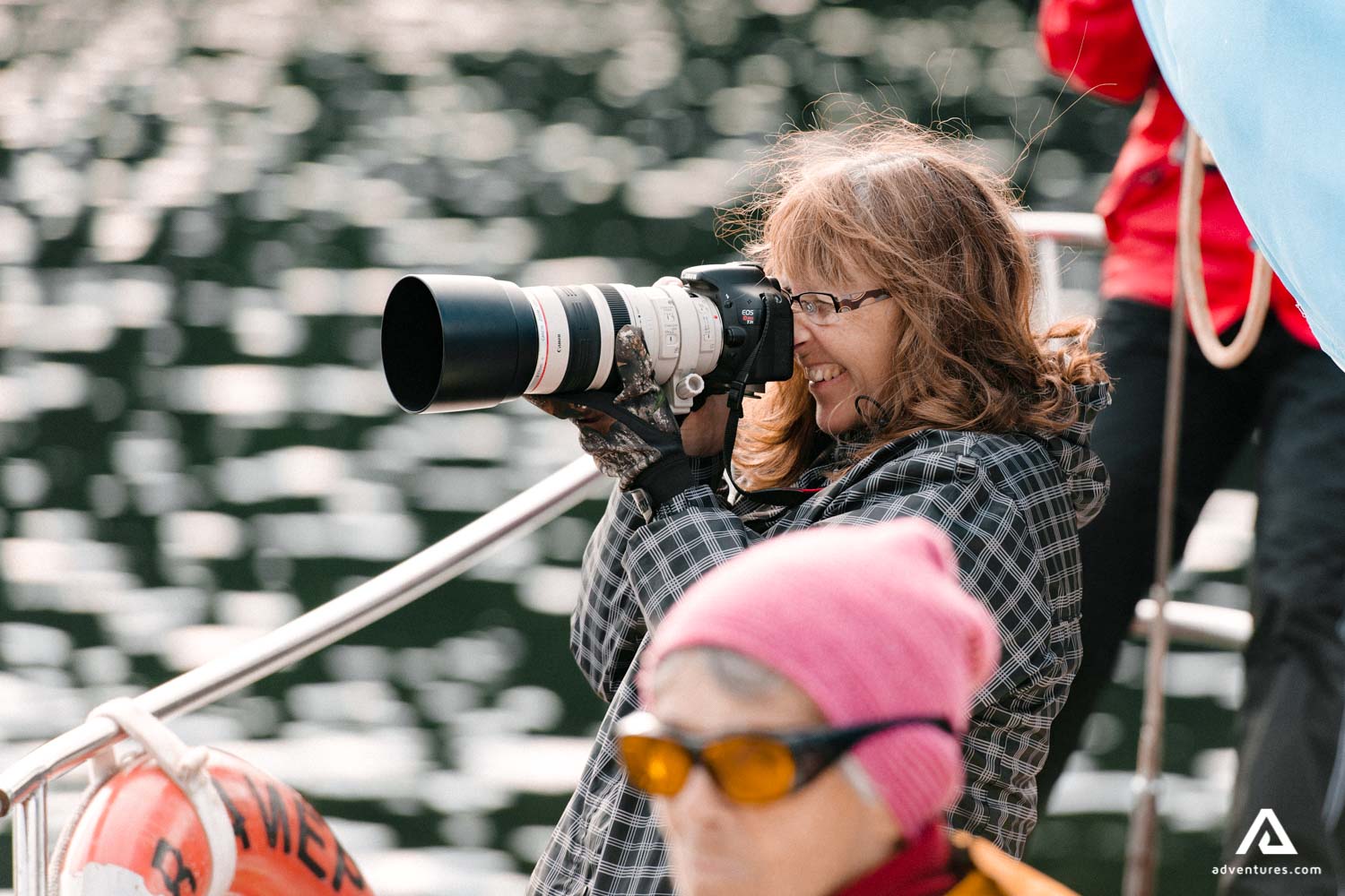 photographer taking pictures from a boat