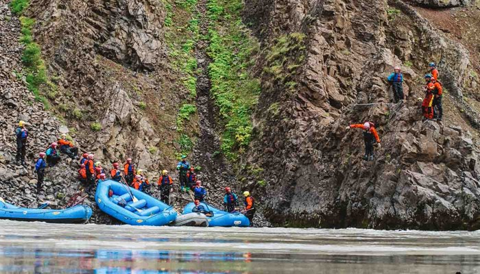 People Jumping From Cliff While Rafting Iceland