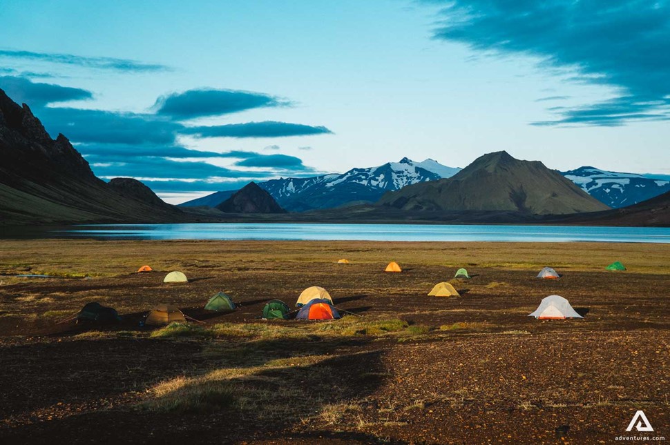 Camping Place In Iceland With Tents By The Lake
