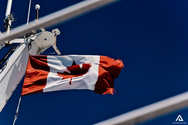 waving flag of canada on a pole