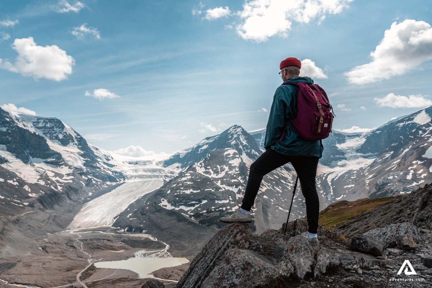 man standing near wilcox peak in canadian rockies
