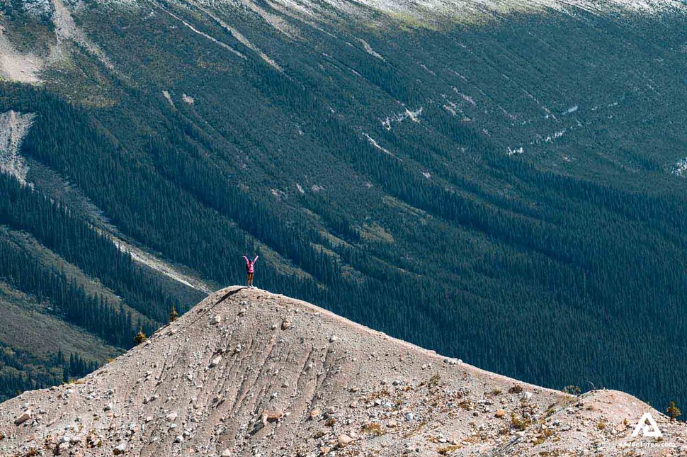 standing on top of a mountain in canada