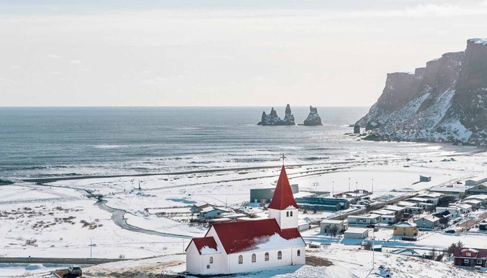 Aerial View Of Vik Town Covered In Snow