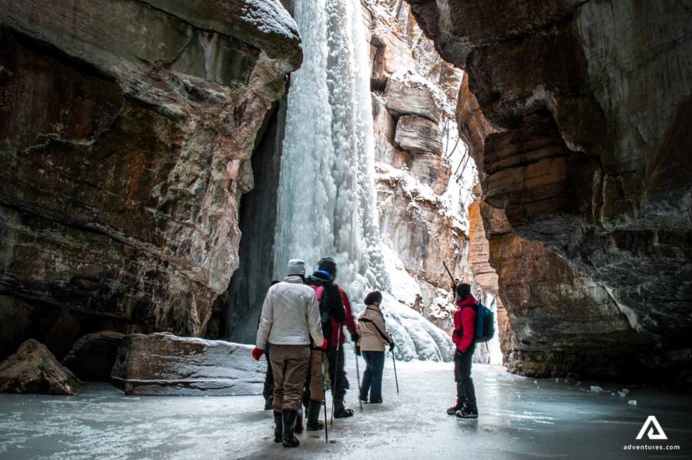 walking with a guide near maligne canyon in canada