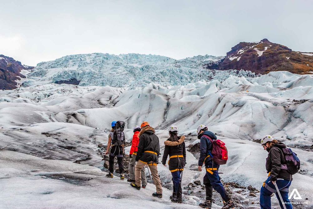 small group hiking on a glacier