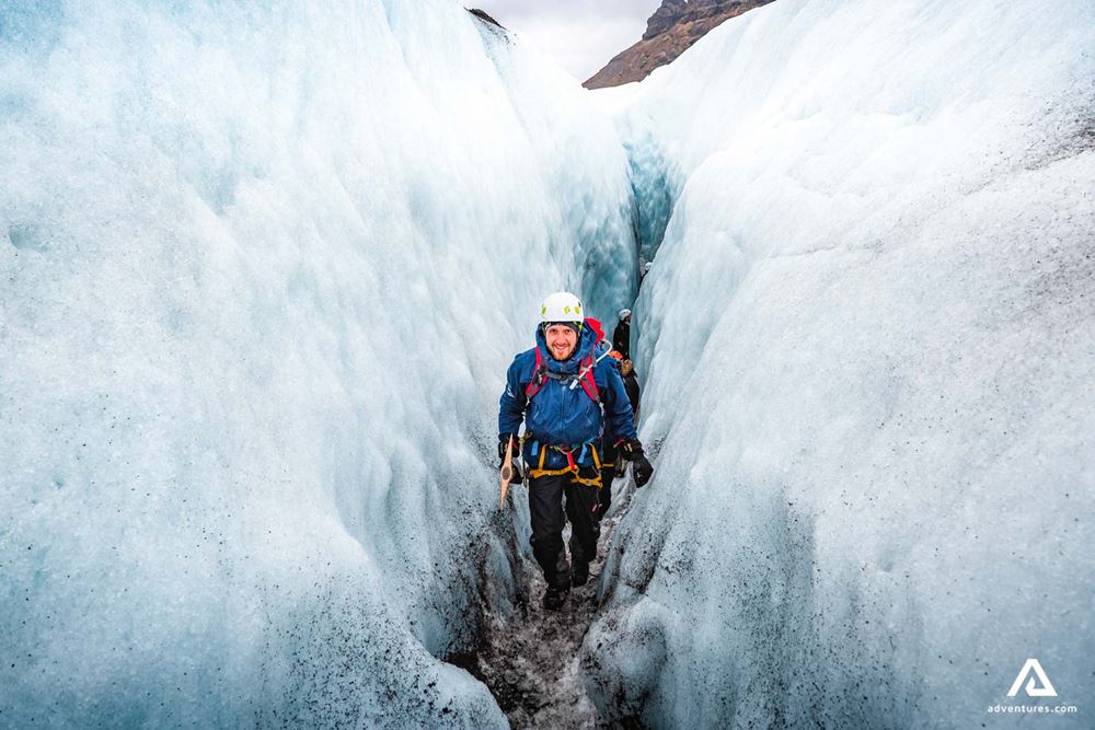 guide hiking in a crevasse