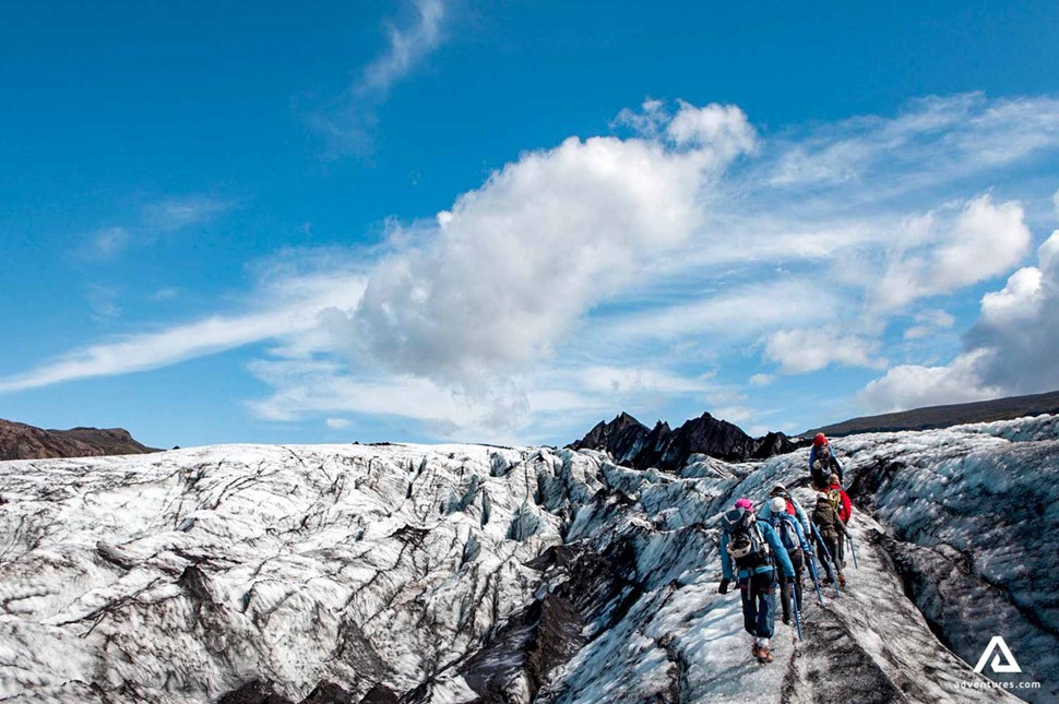 People Hike Solheimajokull Glacier In Iceland