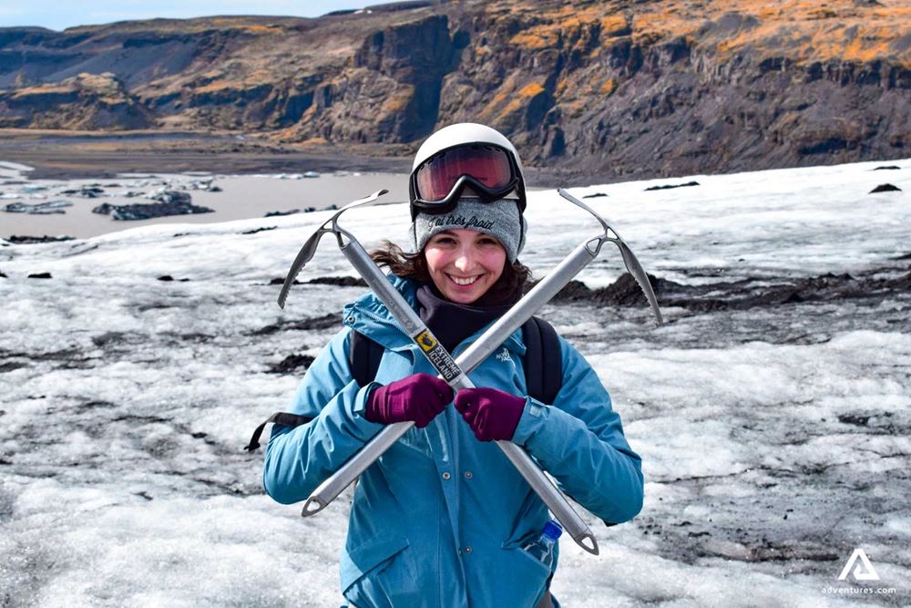 happy woman with two ice axes