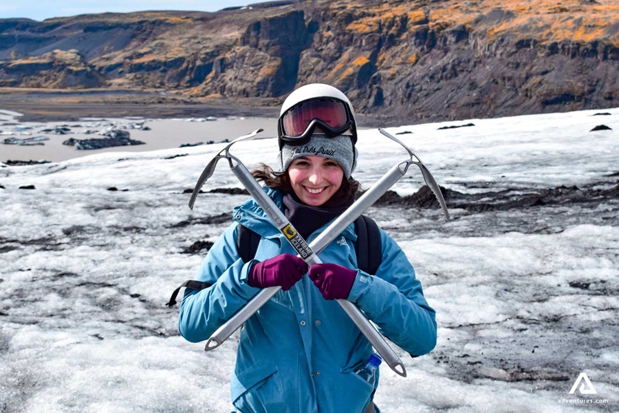 happy woman with two ice axes