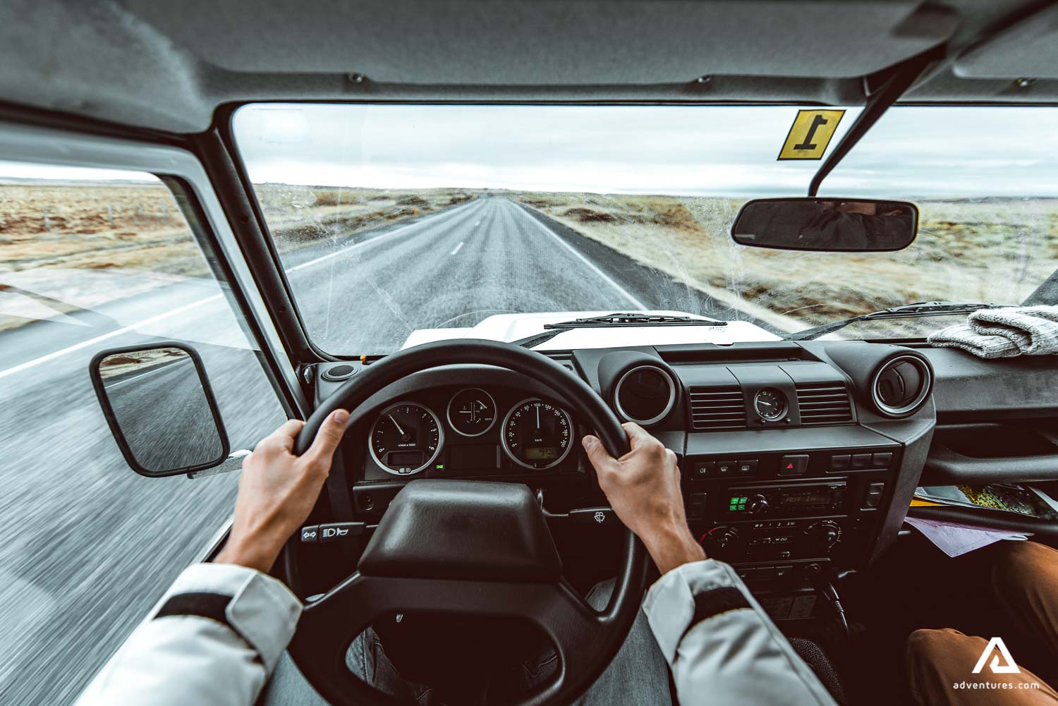 driving a jeep in iceland on a road