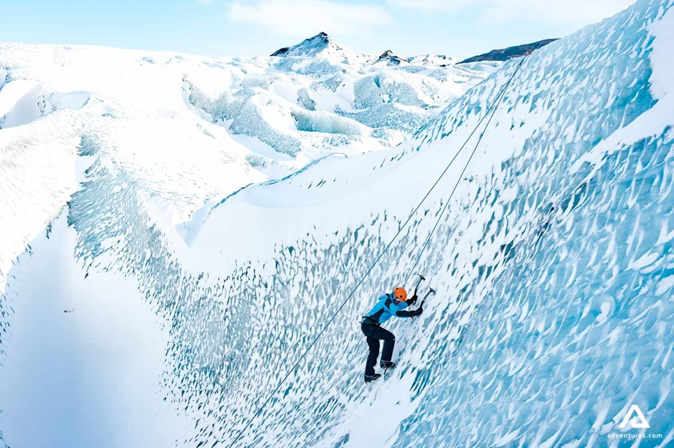 solo ice climbing a glacier wall