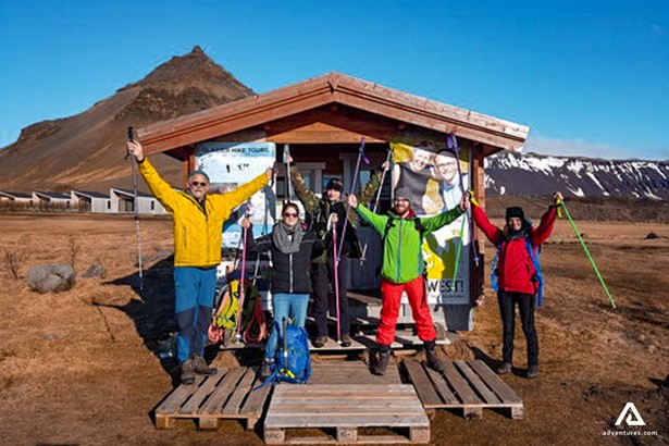 happy group at a meeting location in Arnarstapi in iceland