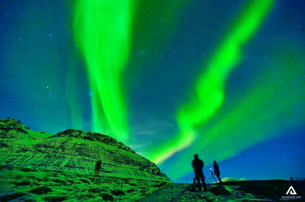 very bright green northern lights in iceland at winter