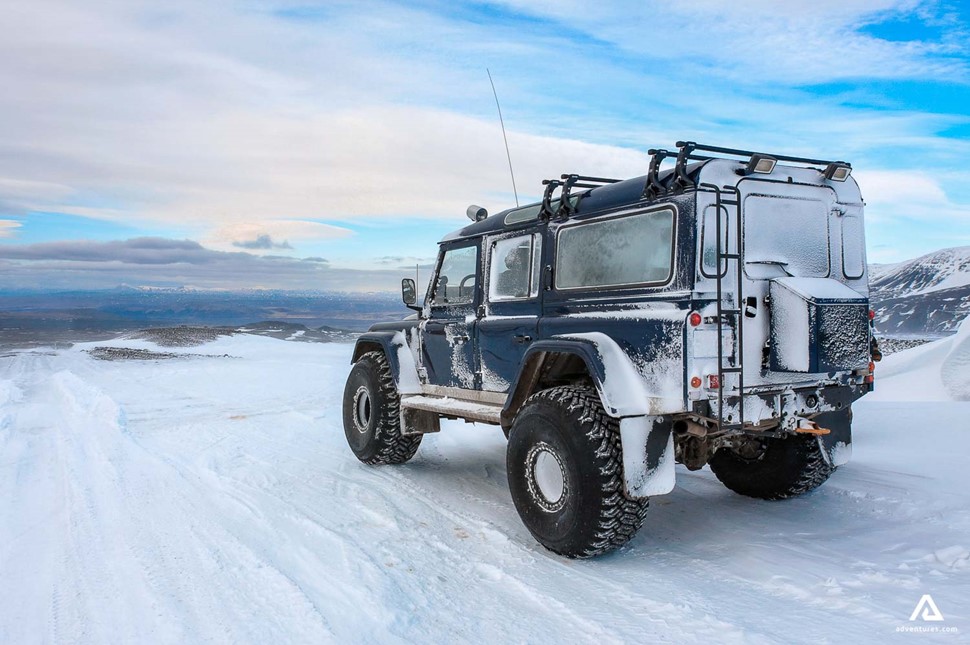 jeep on a frozen icy road in iceland in winter