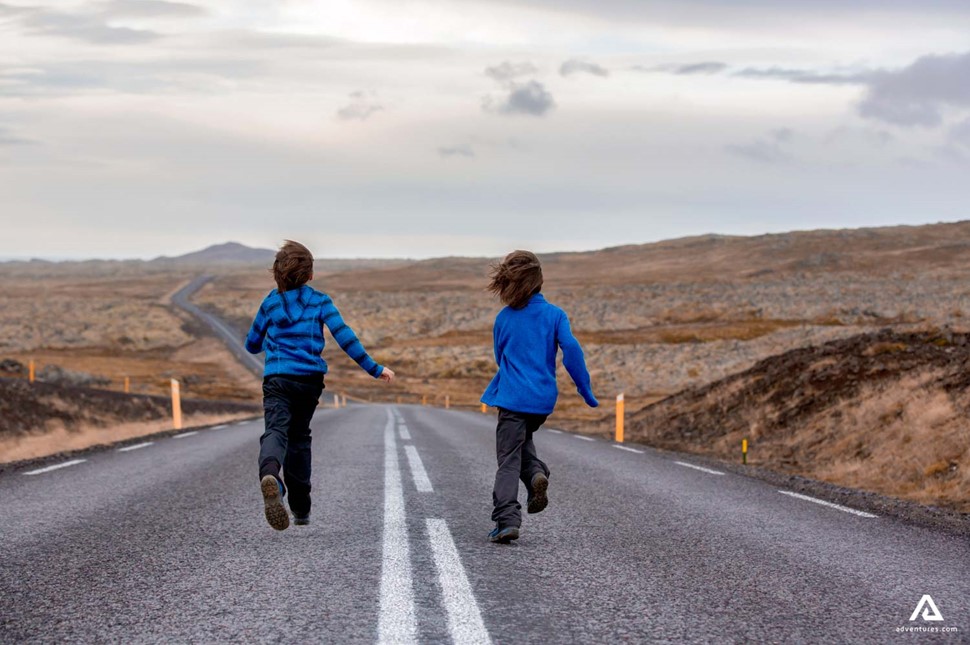 Kids Running On An Empty Road Iceland