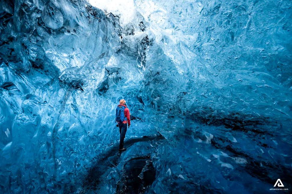 Man Exploring Crystal Ice Cave