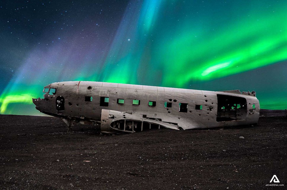 Northern Lights And  Plane Wreck On Black Sand Beach