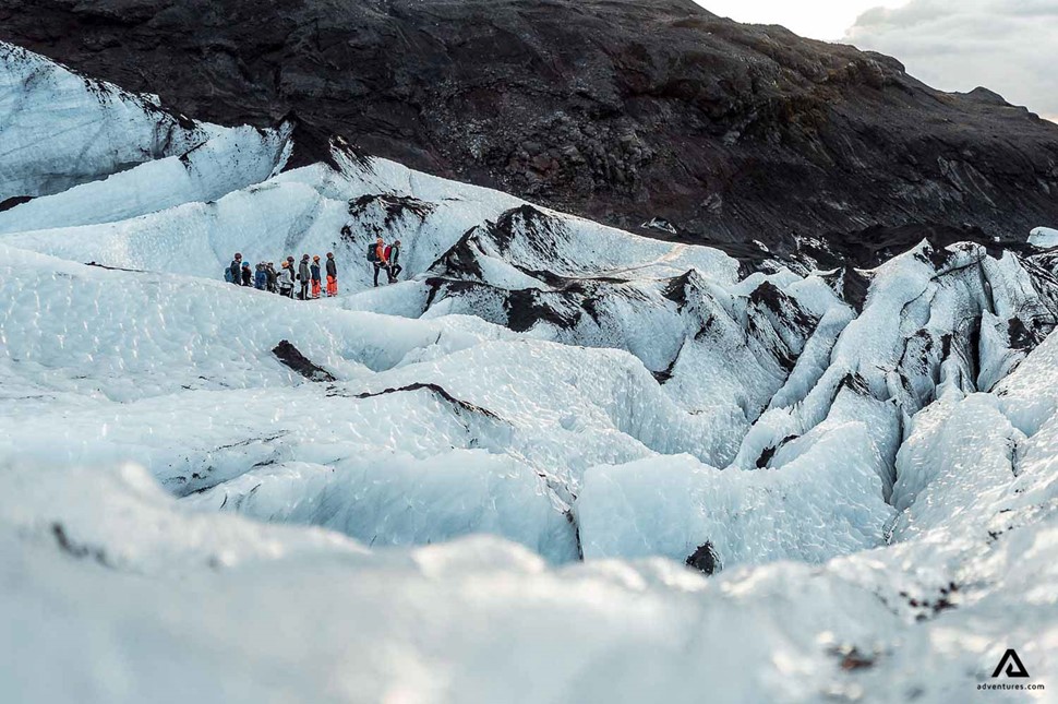 Group Of People Hiking On Solheimajokull Glacier