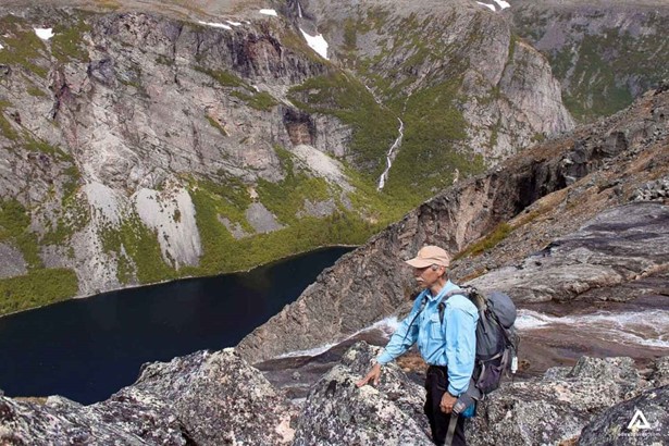 man trekking labrador fjords in canada