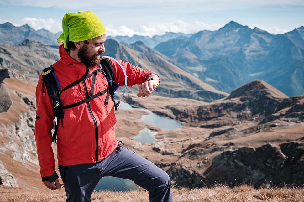 Young Man Looking At The Gps Track while Hiking in Iceland