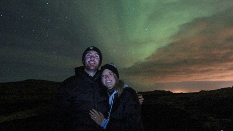 Couple Under Aurora Borealis