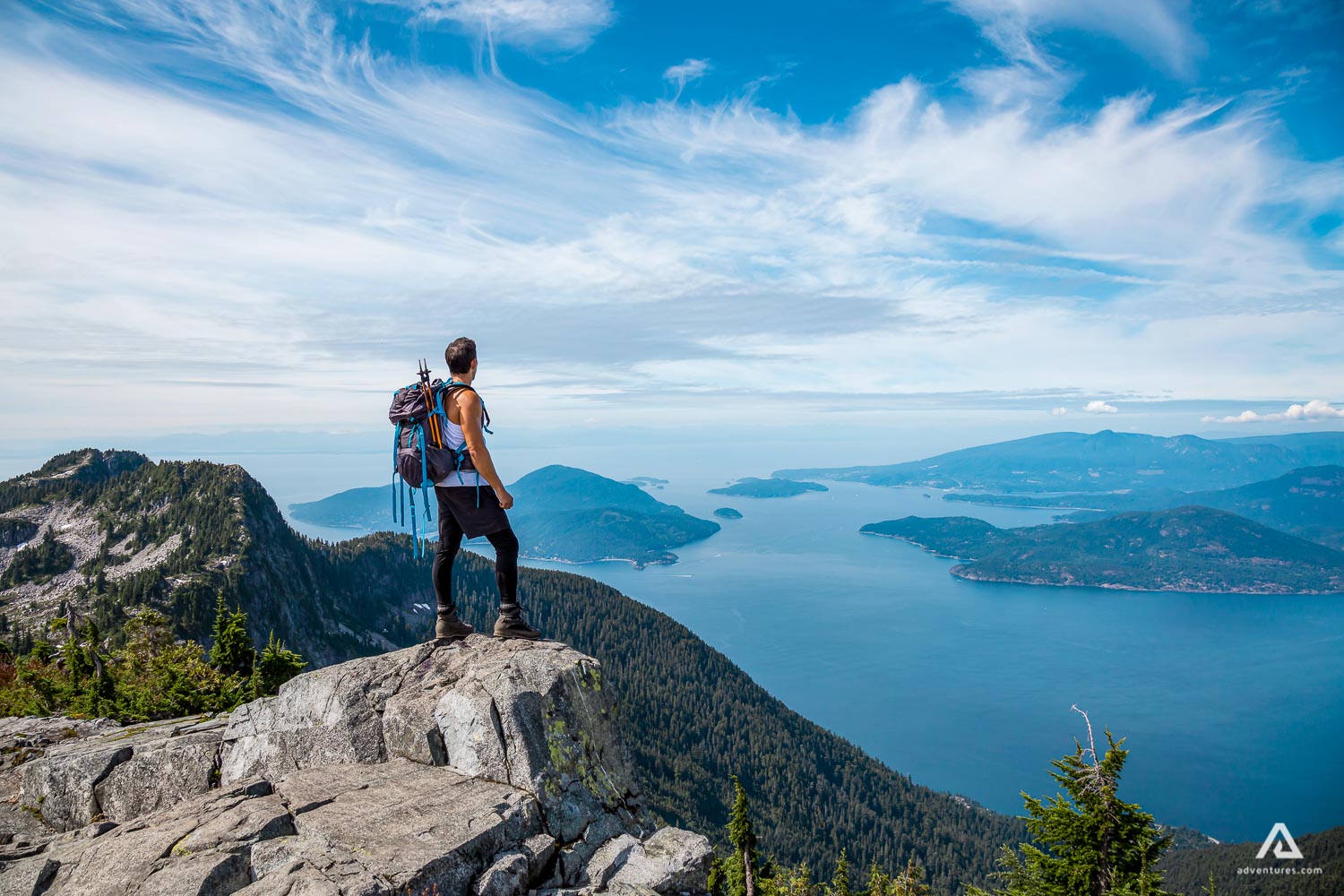 Man standing on rocky cliff in British Columbia