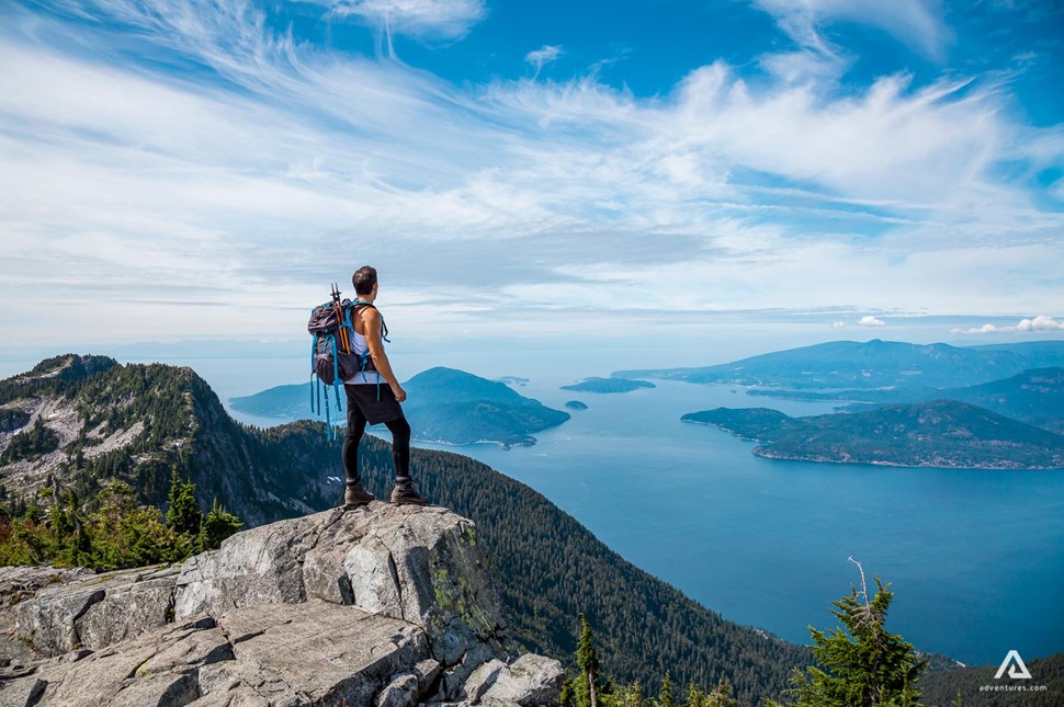 Man standing on rocky cliff in British Columbia