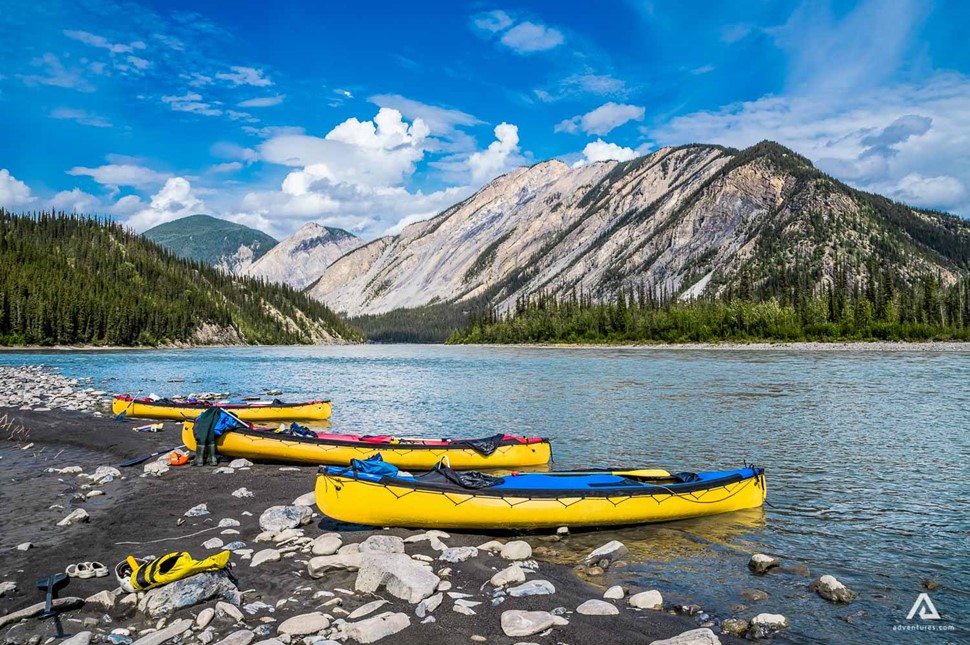 Canoes lined up on the Nahanni River bank