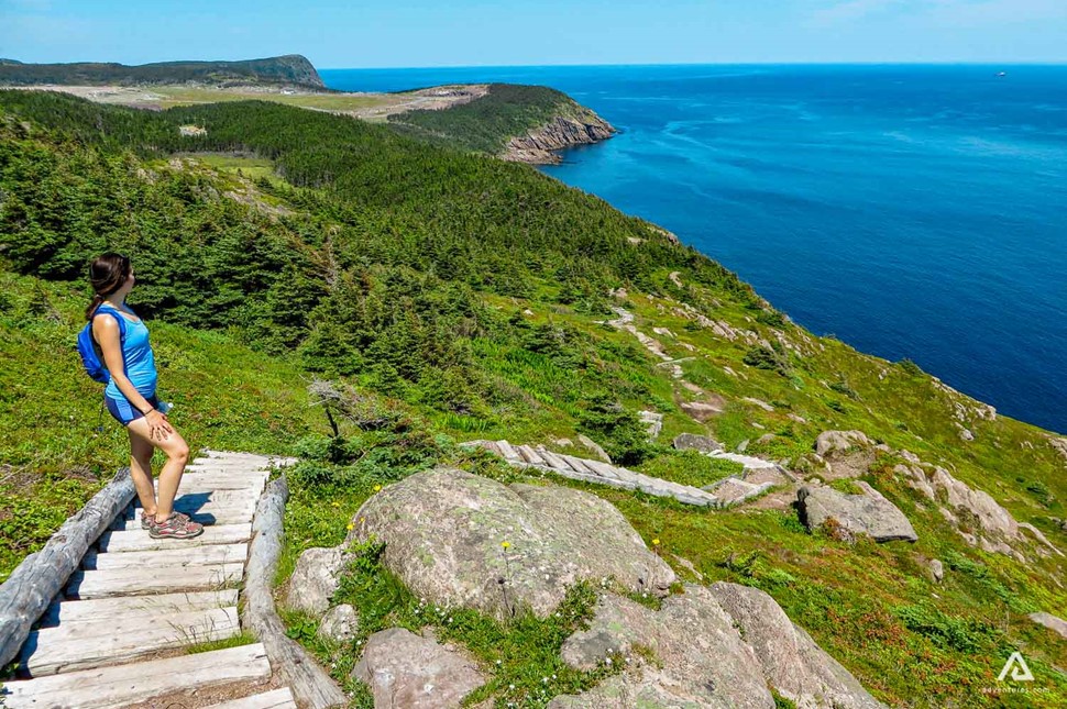 Woman Hiking The East Coast Trail in canada at summer