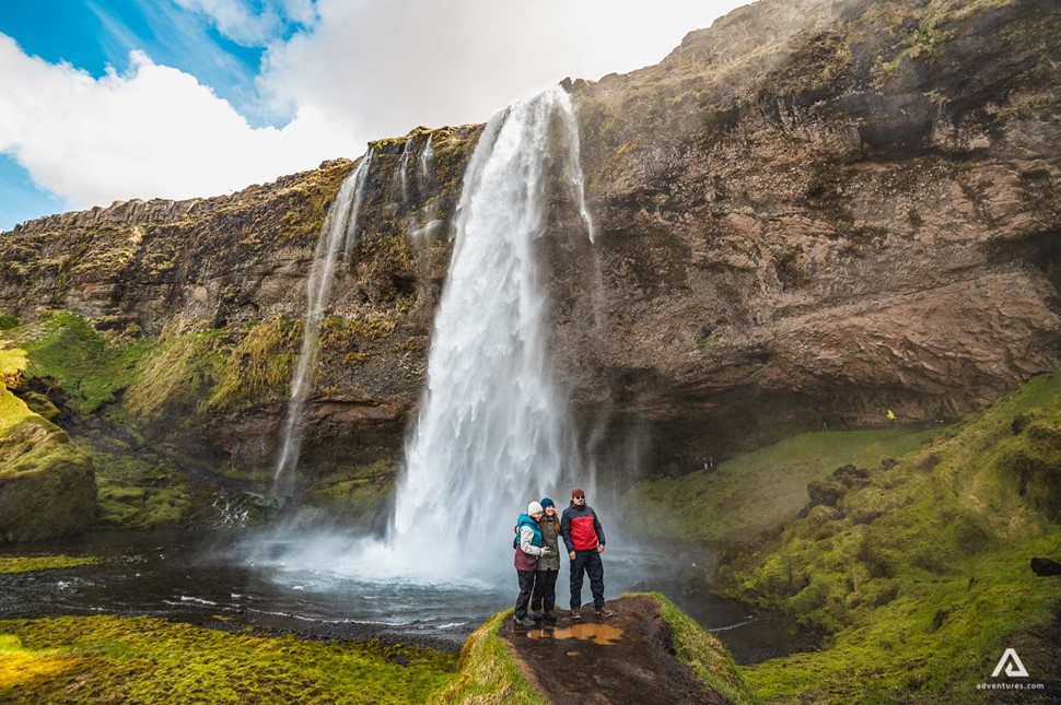 Taking photo in front of Seljalandsfoss Waterfall