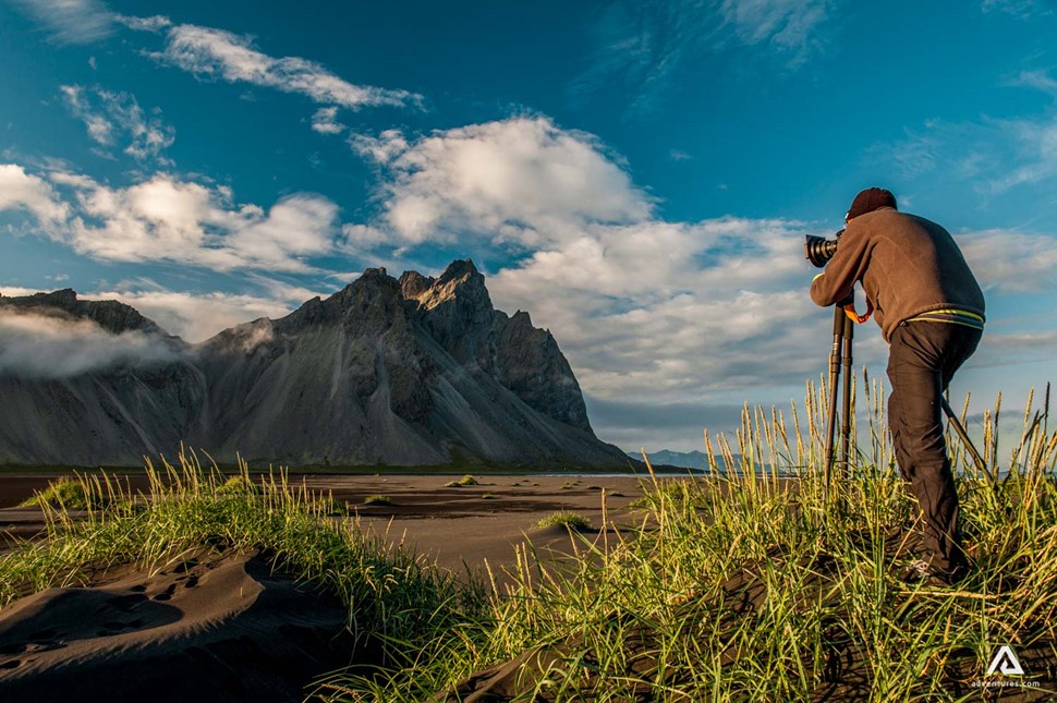 Photographer taking picture of Vestrahorn Mountain