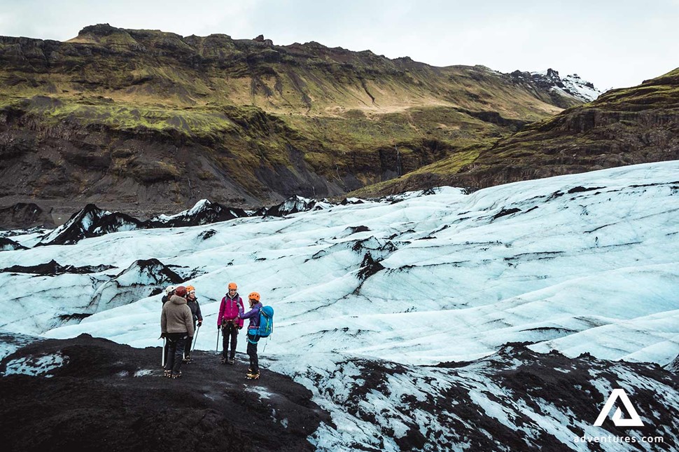 people hiking on the Solheimajokull glacier