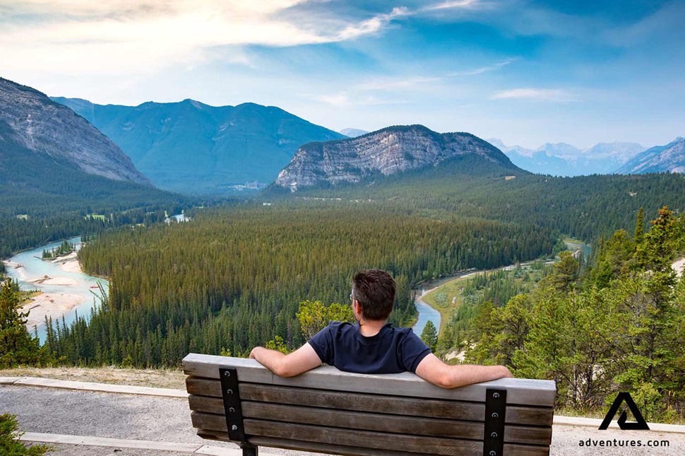 sitting on a a bench and enjoying the view at banff national park