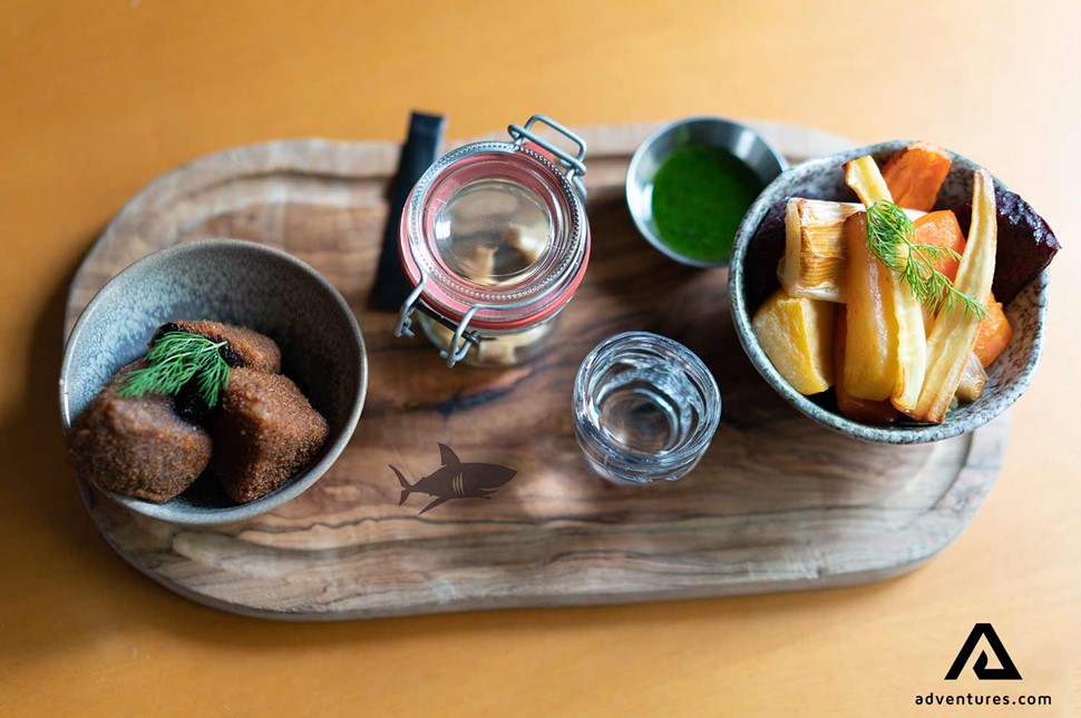 entree plate served with icelandic shark hakarl