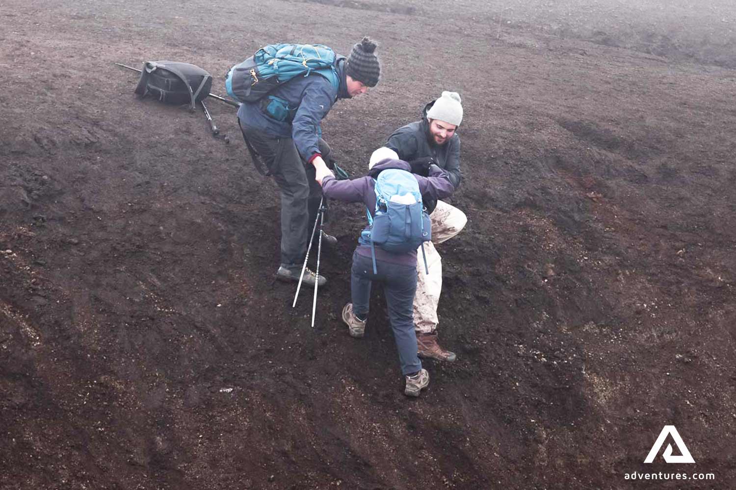 helping to climb a steep area on a mountain