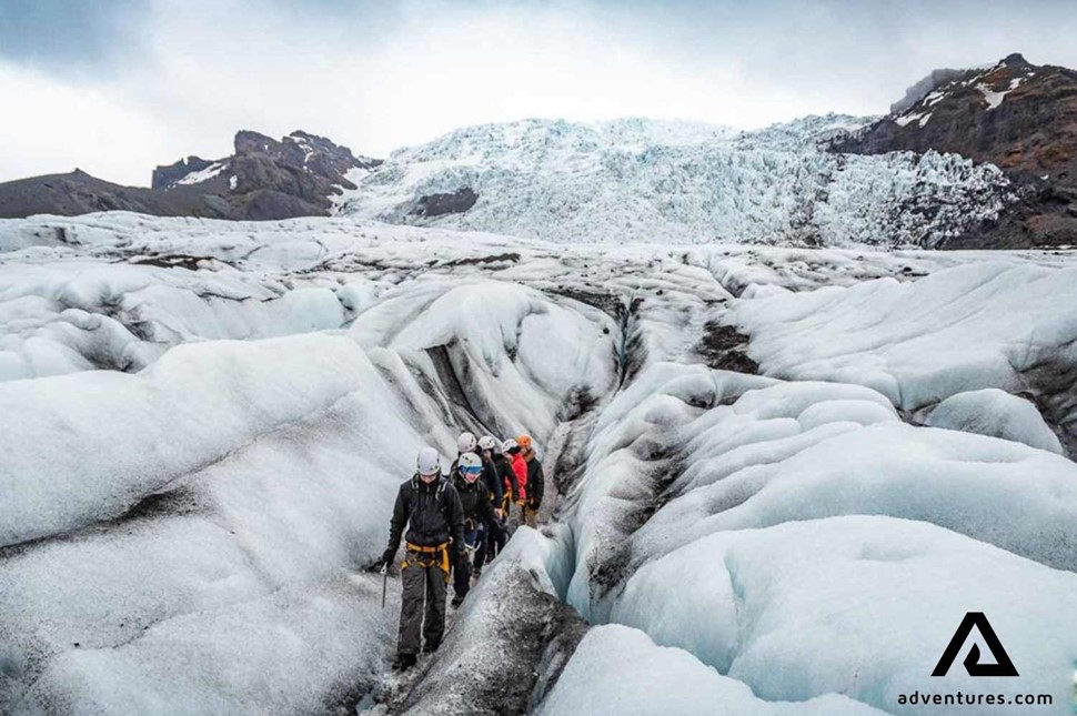 small group hiking falljokull glacier