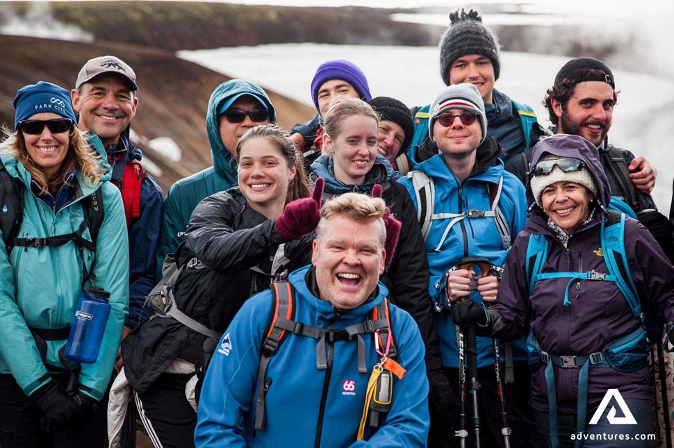 happy group of hikers posing for a photo in iceland