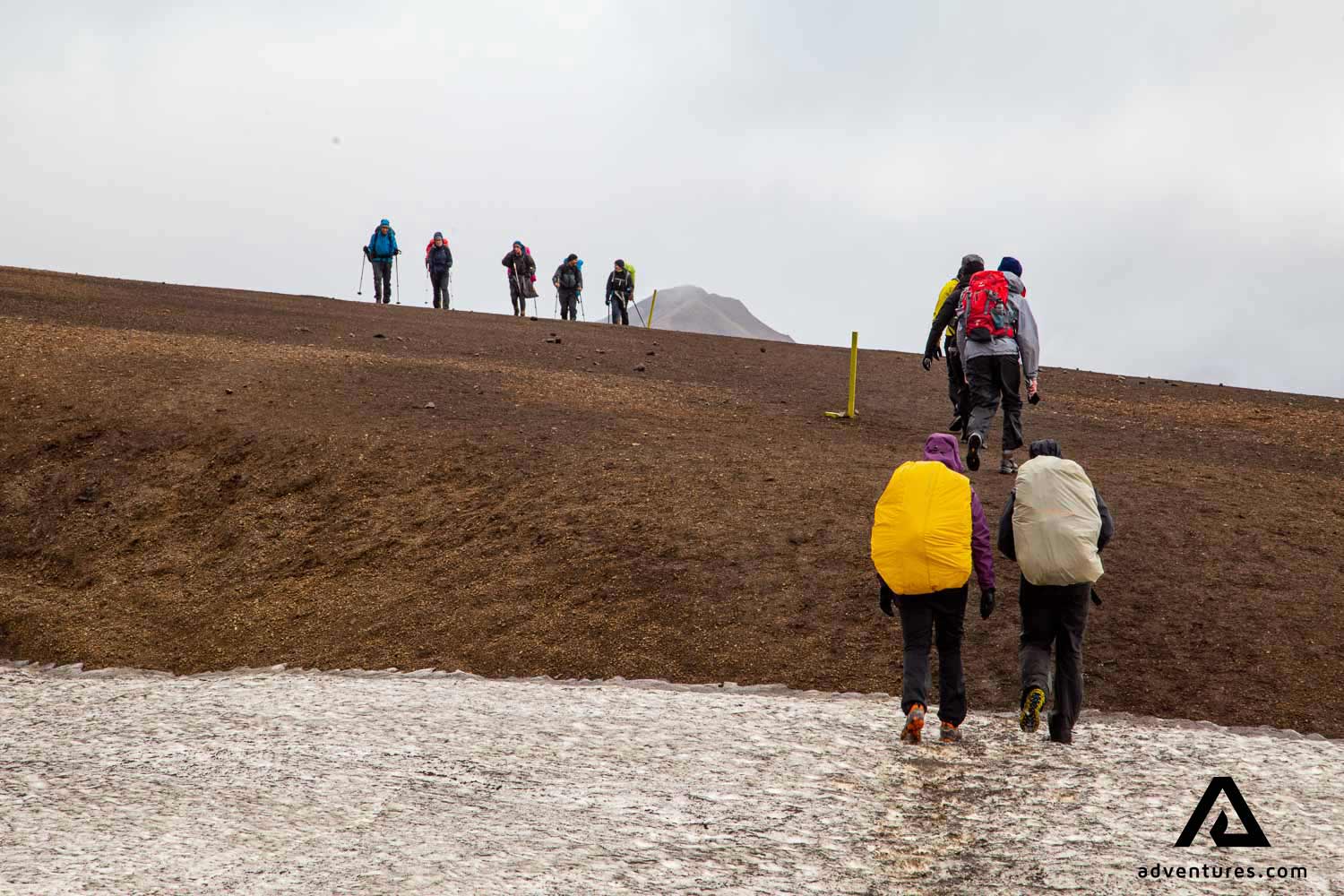 trekking on a rainy day in landmannalaugar in iceland