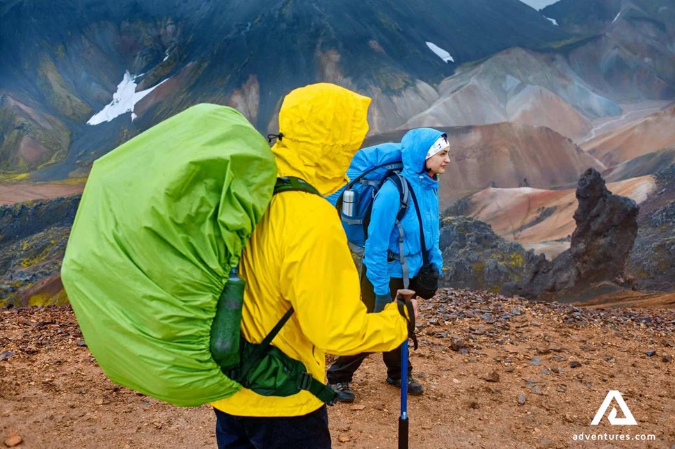 woman trekking on bad weather in iceland