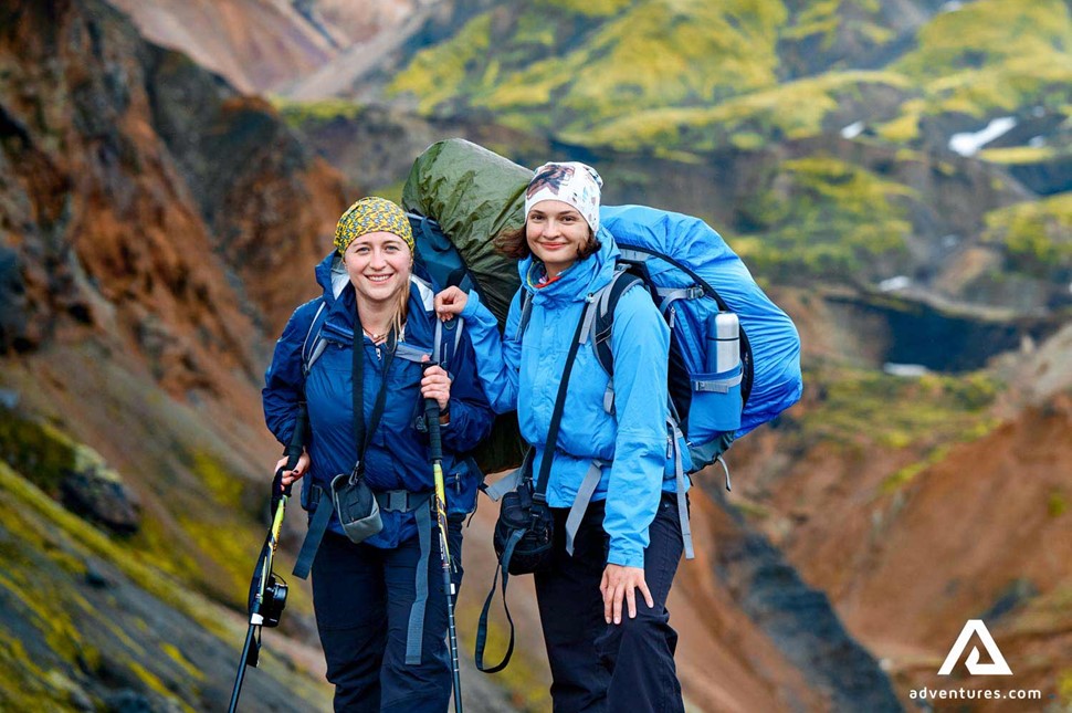 two smiling female hikers in iceland