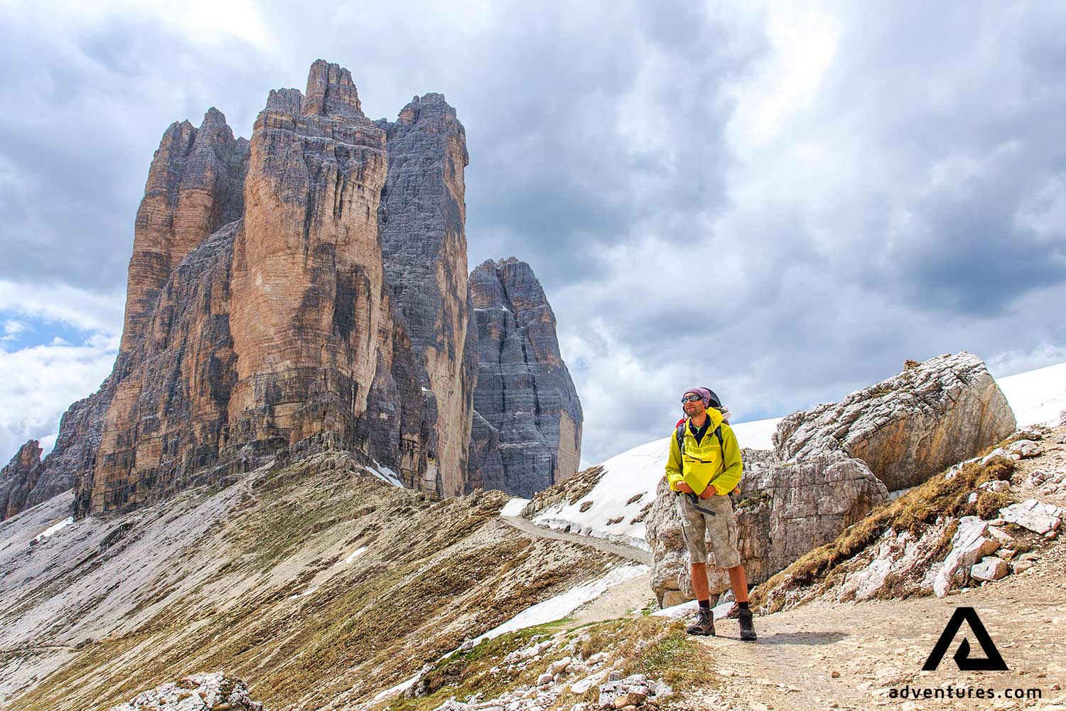 man hiking near dolomites alta via uno in italy